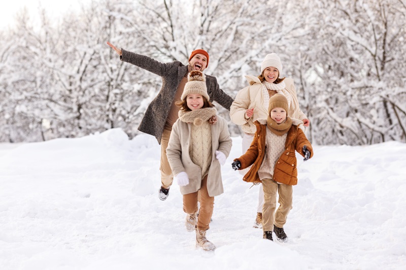 family walking outside on winter day