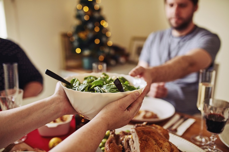 person sharing healthy holiday side dish