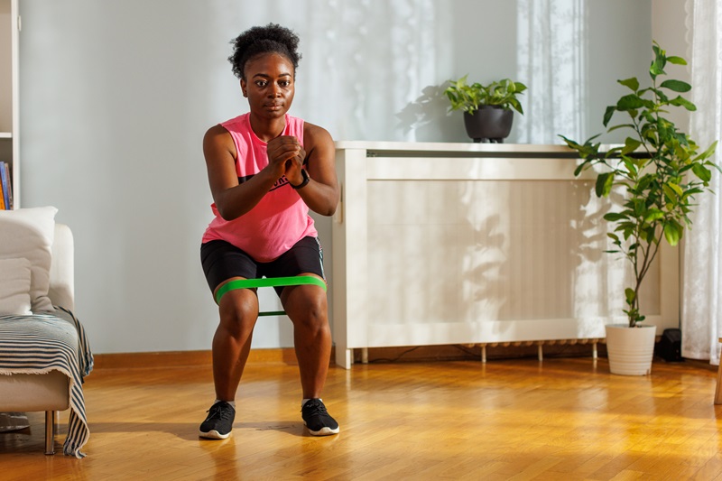 woman doing a resistance band exercise