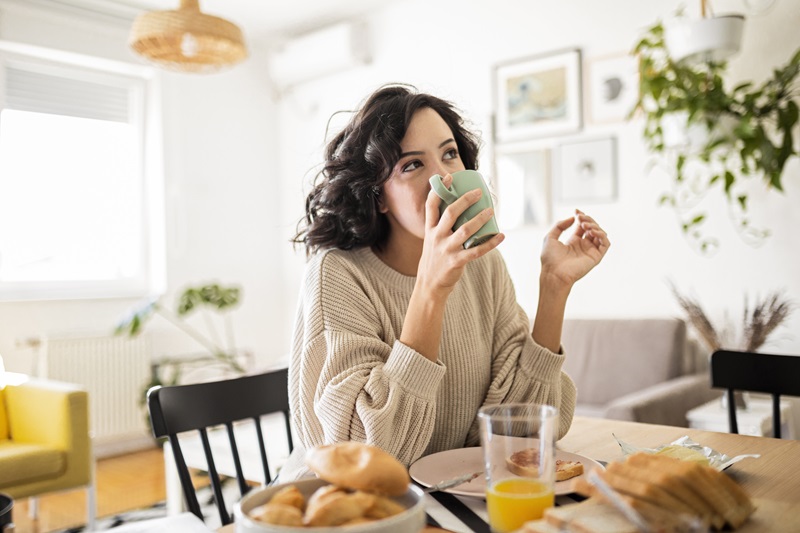 woman eating breakfast on a holiday morning