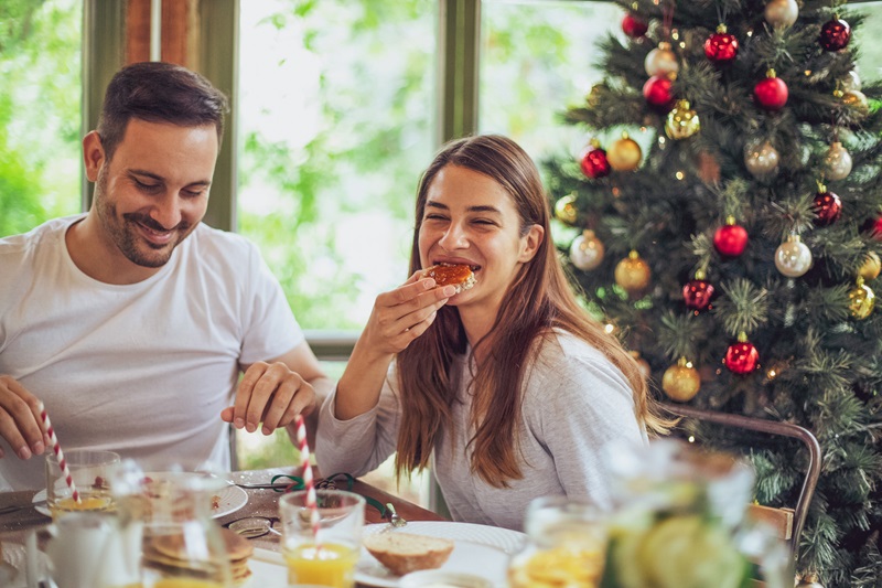 couple eating a healthy breakfast on Christmas holiday morning