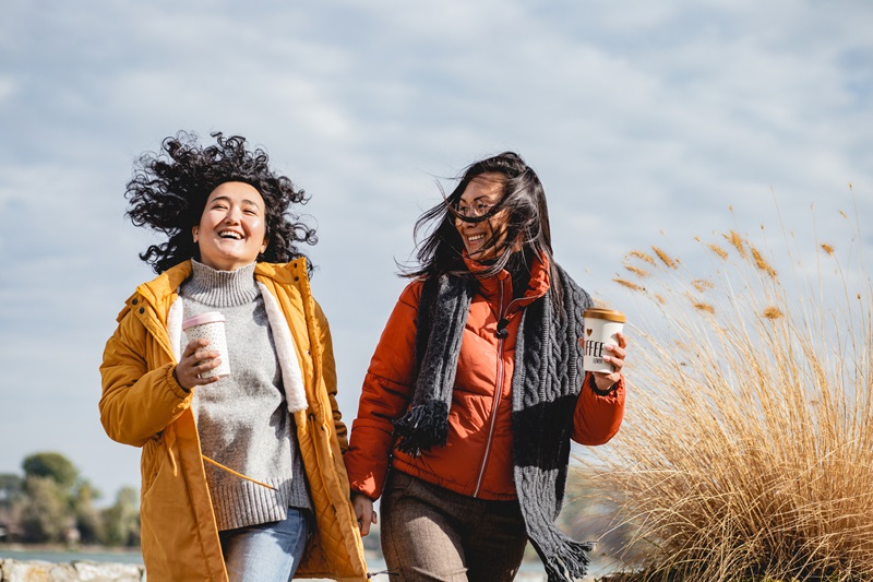 2 Women Embracing Nature and getting Fresh Air with a walk break