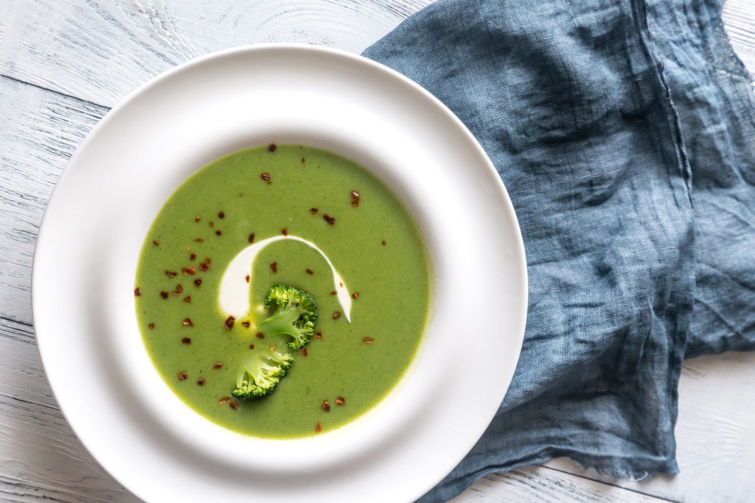 Portion of spicy broccoli soup with red pepper flakes