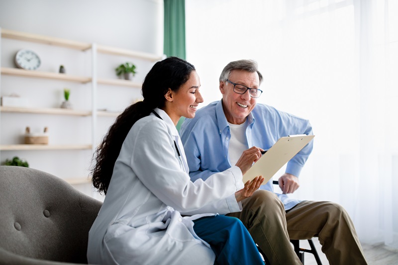 man speaking with doctor