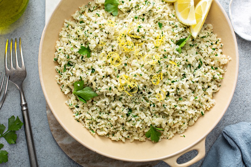 Lemon herb cauliflower rice cooked in a pan