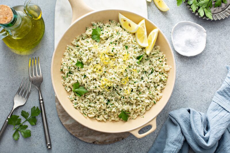 Lemon herb cauliflower rice cooked in a pan