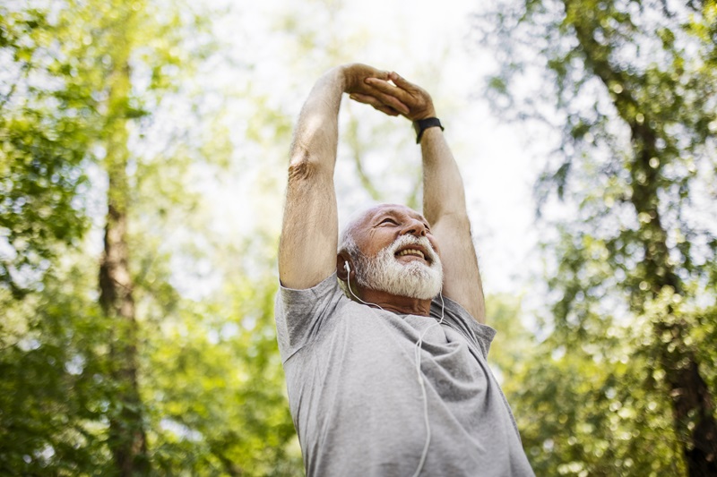 man stretching before a morning workout