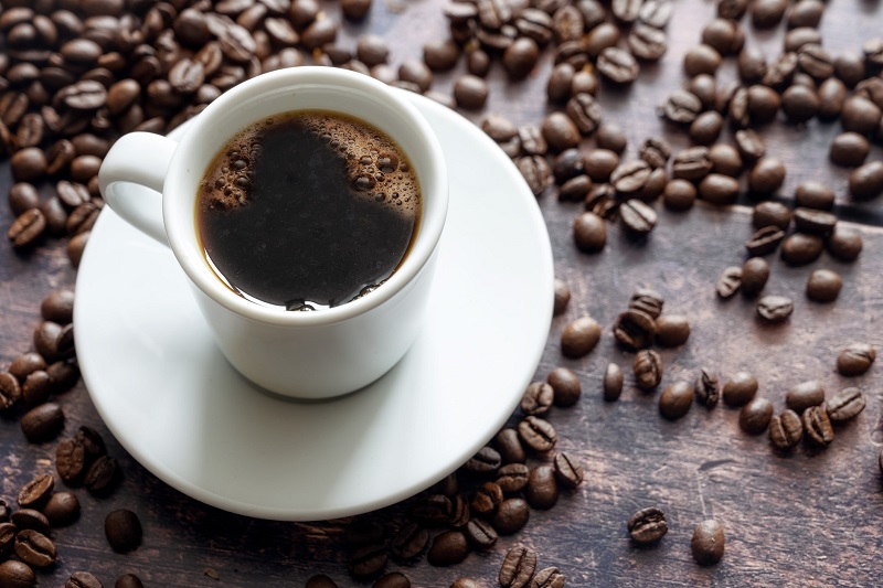 White cup with strong black coffee 