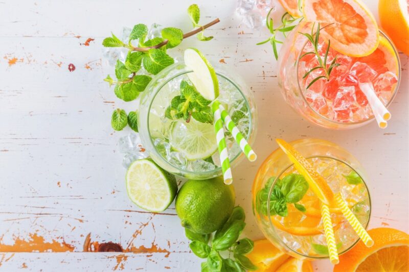 various colorful infused waters with fruits and herbs